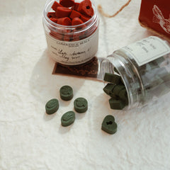 LimerenceSeals 'Late Autumn' handmade sealing wax beads, featuring red and green beads with intricate designs. The wax beads are ideal for envelope sealing, crafting, and adding a touch of elegance to your correspondence.