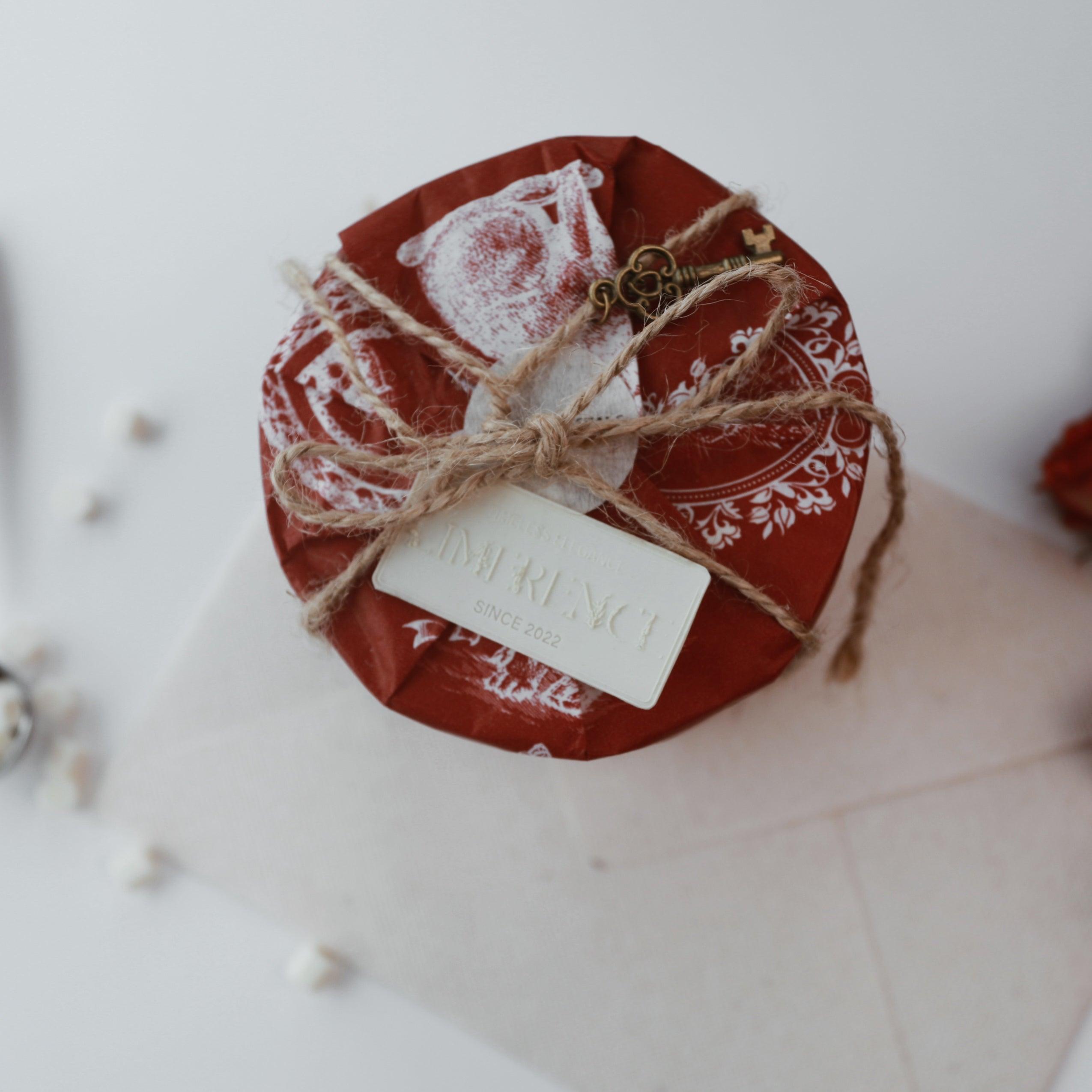 Artfully wrapped gift featuring Limerence Seals packaging with a vintage rabbit illustration, tied with rustic twine and a small decorative key. The packaging is adorned with a light yellow wax seal labeled "LIMERENCE - SINCE 2022." This presentation highlights the product's appeal for gifting, combining a classic aesthetic with a touch of whimsy, ideal for special occasions.